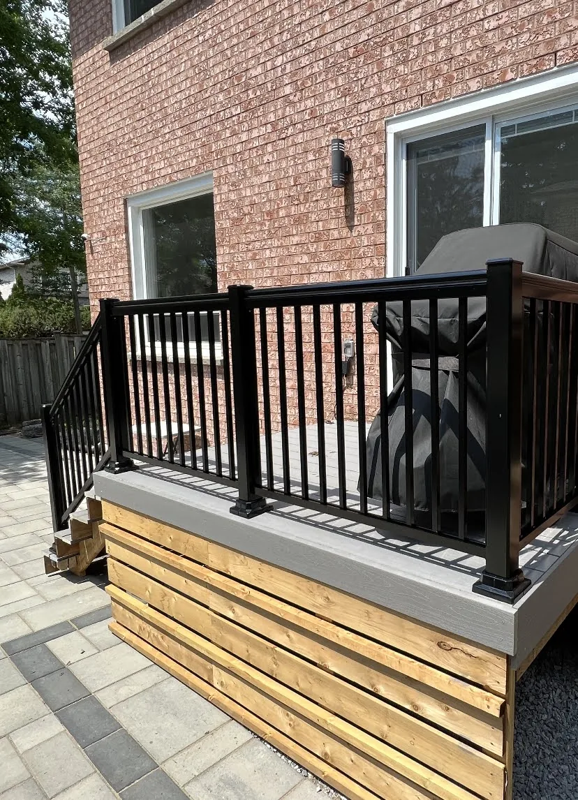 Composite deck landing with black exterior railing
