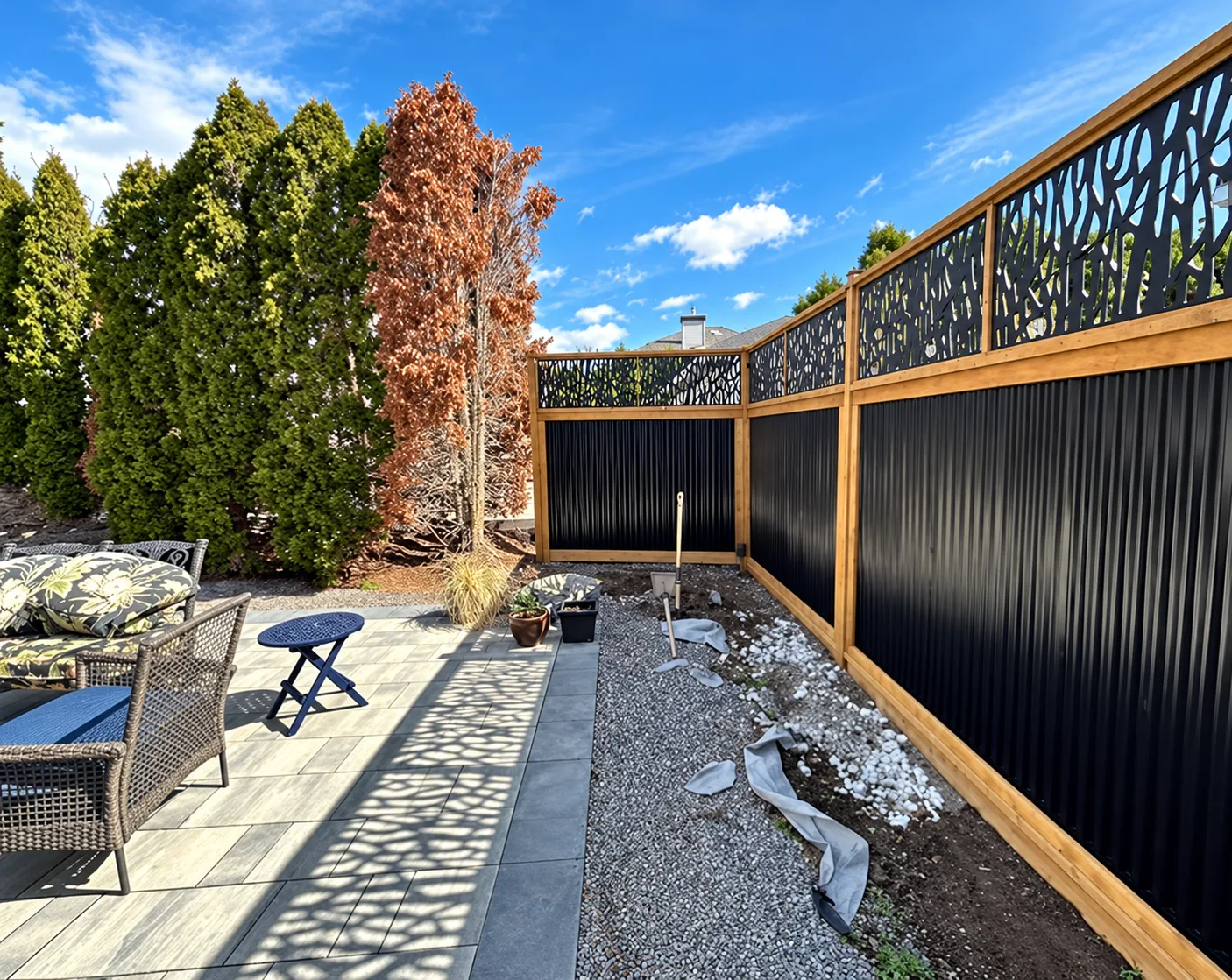 Black composite privacy fence with decorative upper panels