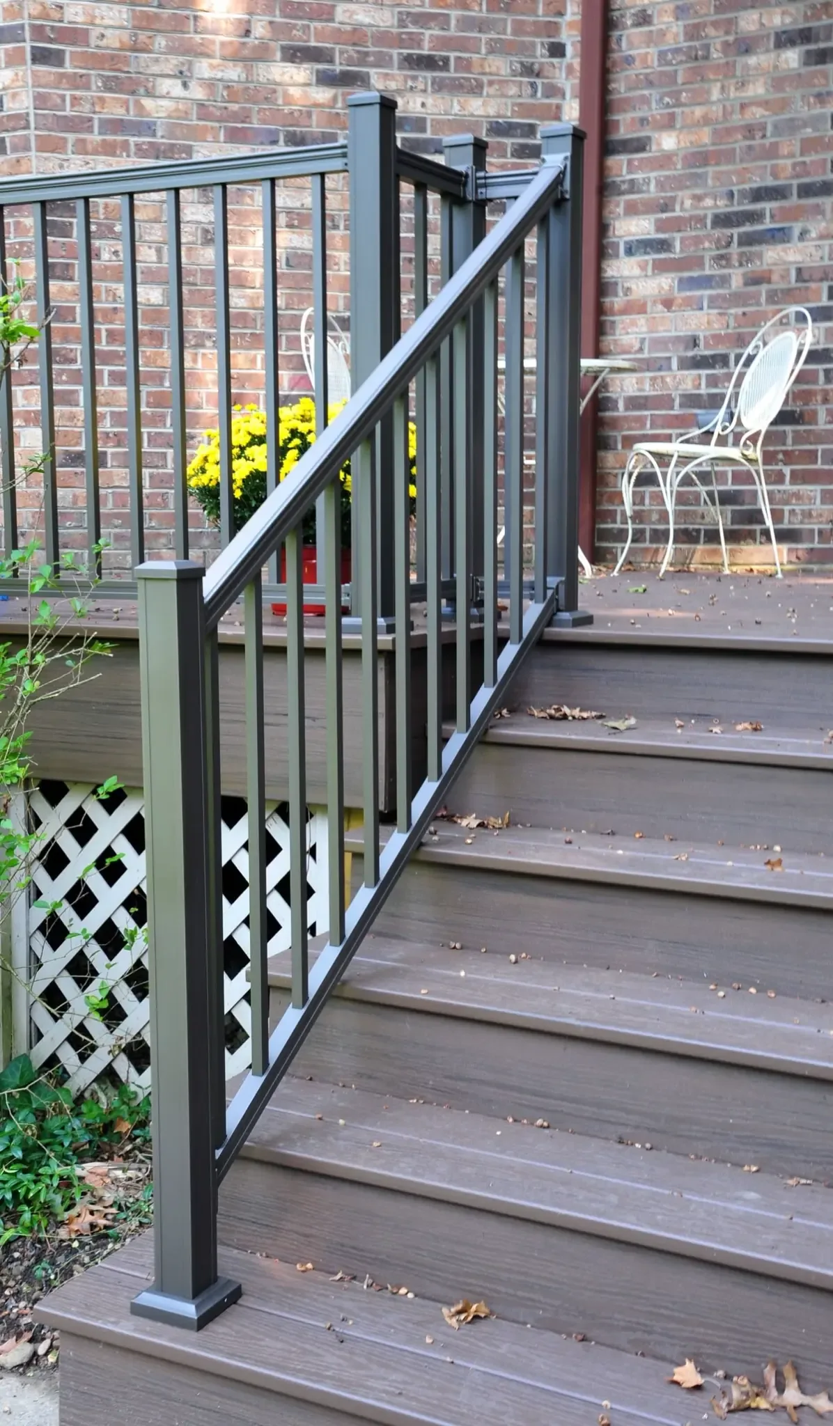 Black metal railing installed at exterior stairs